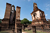 Thailand, Old Sukhothai - Wat Mahathat, on both sides of the main chedi a 12-metre-tall statue of standing Buddha is enshrined in a mandapa.  